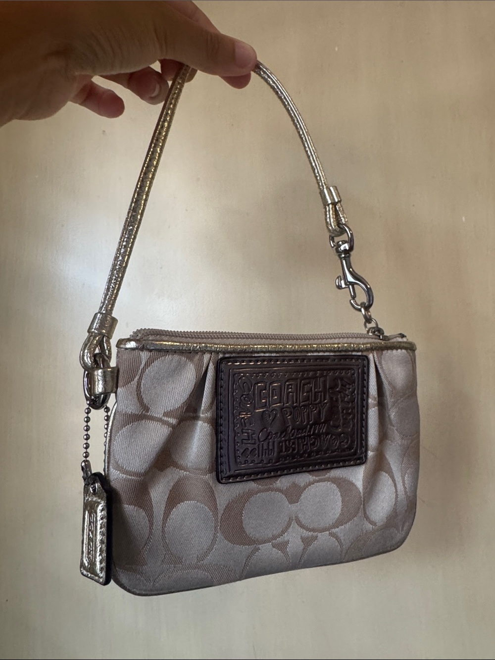 Coach Metallic Champagne Signature Wristlet with Brown Leather Patch
